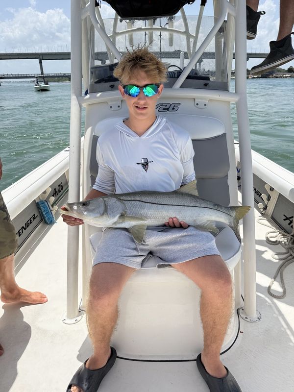 Young angler with a snook from the leaning post