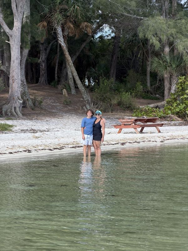 Family on an island beach during an island hopping trip