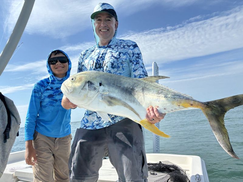 Father and son with a jack crevalle