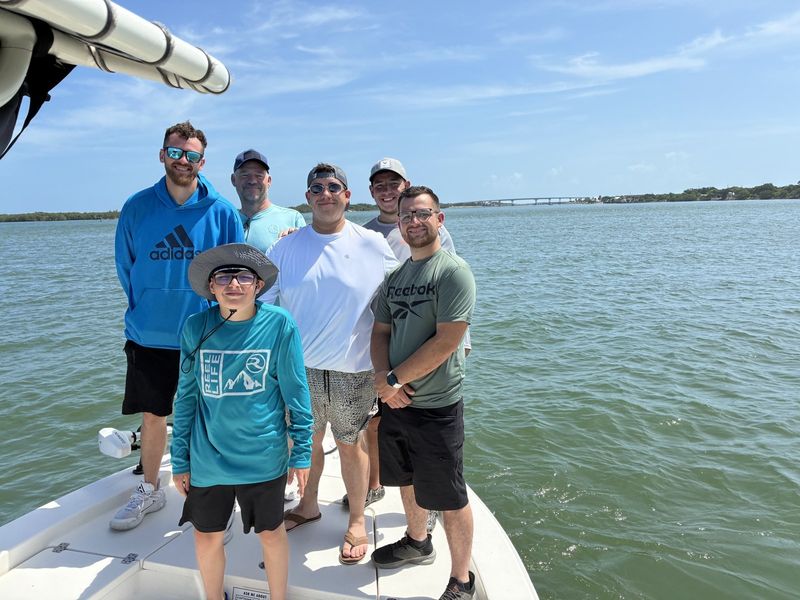 Group of friends aboard on a sandbar trip